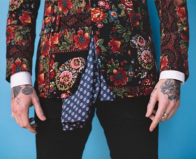 Image of man wearing printed jacket